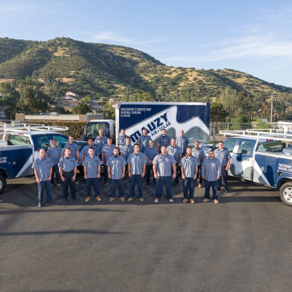 Mauzy installers posing in front of Mauzy vehicles