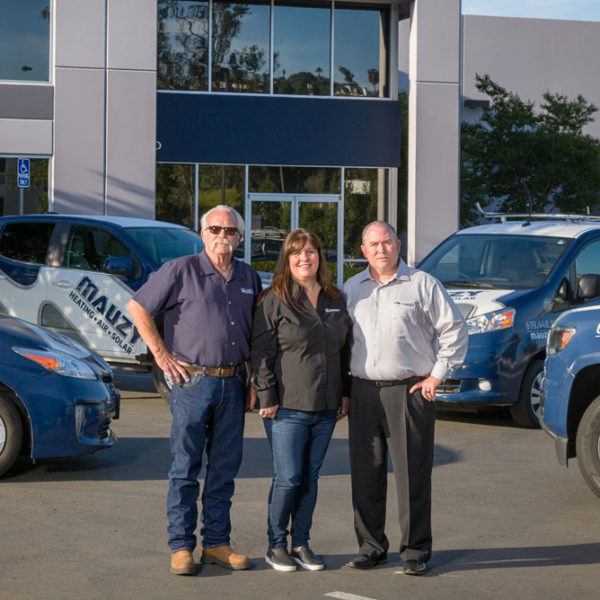 Gary Mauzy, Jennifer Mauzy and Matt Mauzy posting in front of Mauzy offices.