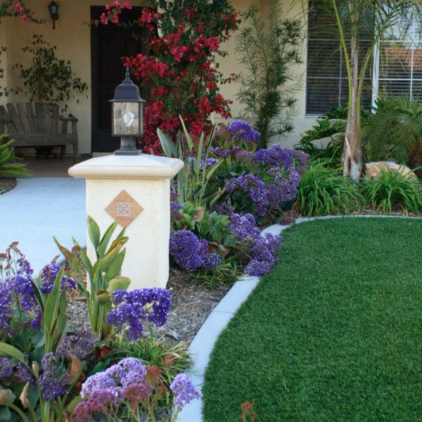 exterior of the front yard of a customer's home with an artificial turf installation