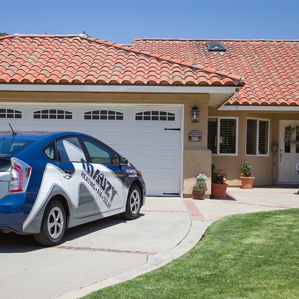 Mauzy company vehicle parked outside a customer's home