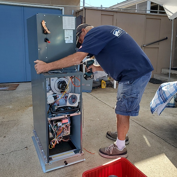 mauzy installer installing new furnace