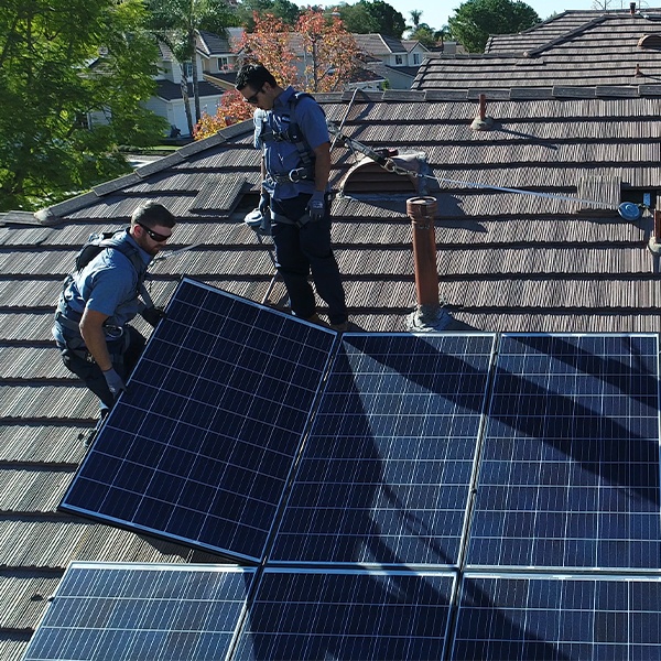 Mauzy solar technicians repairing solar on a roof