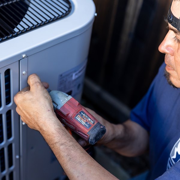 mauzy tech doing maintenance on elite by mauzy air conditioner