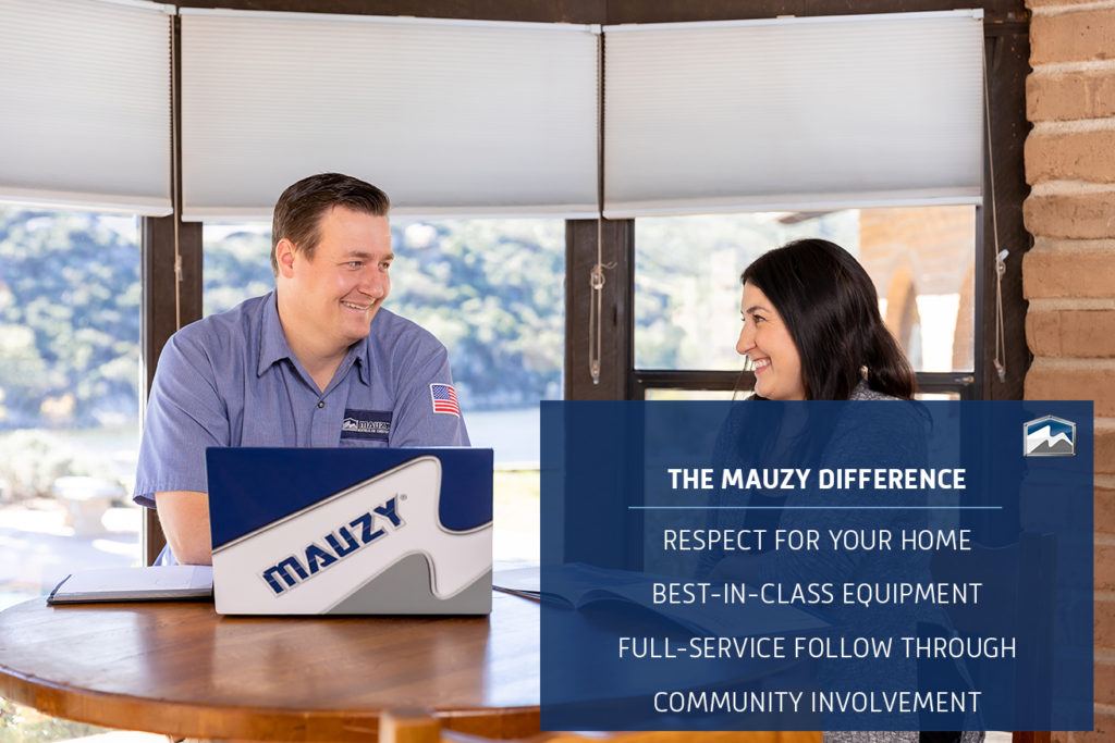 mauzy comfort advisor talking with homeowner around a table