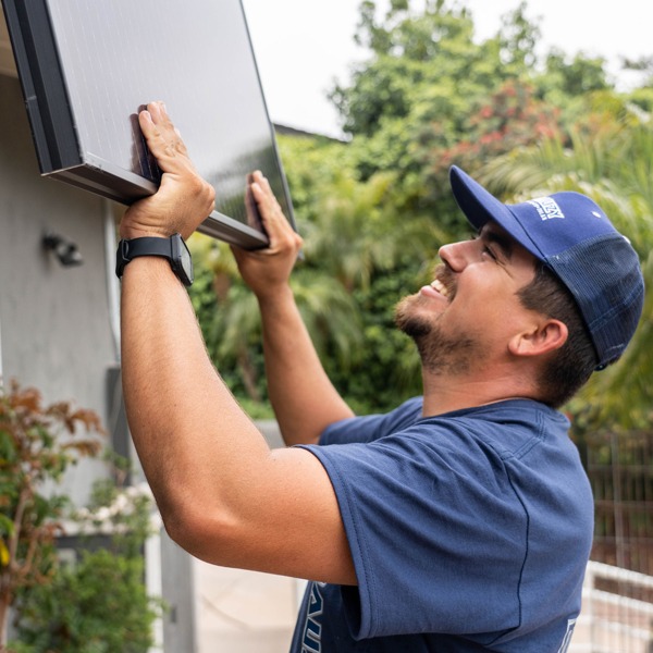 Mauzy technicians installing solar on a roof