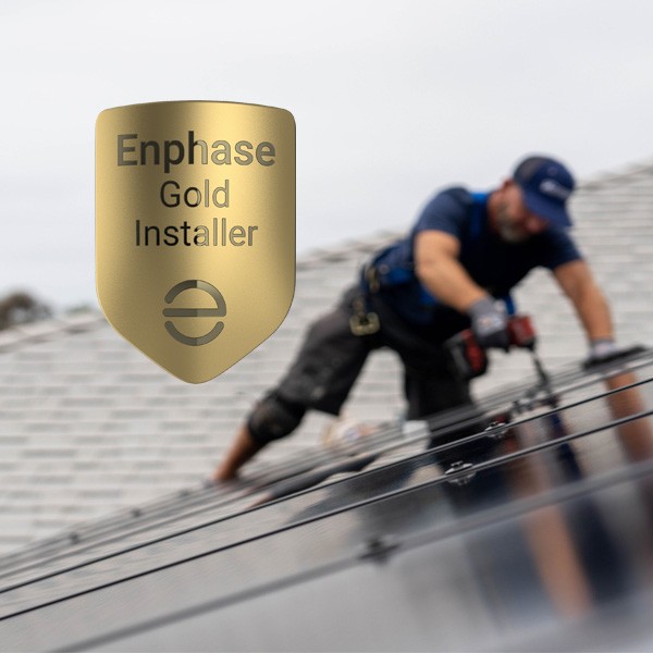 mauzy solar technician installing solar on a roof